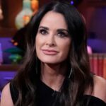 Kyle Richards smirks during an appearance on WWHL